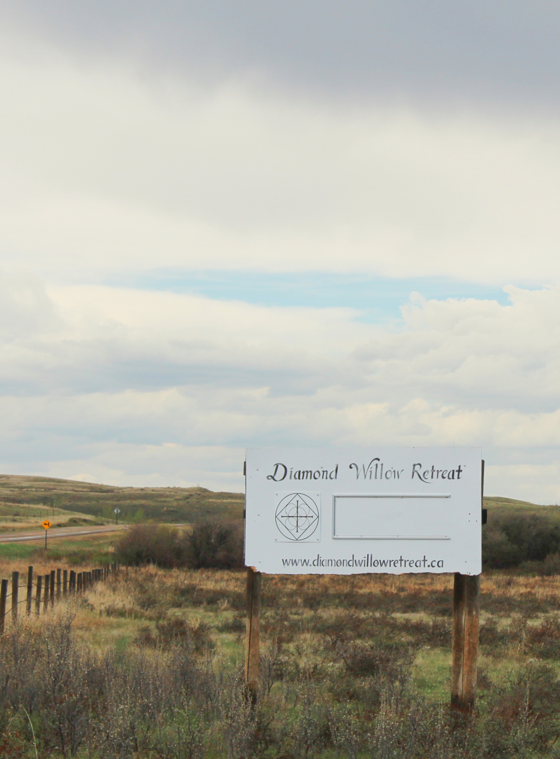 Signboard by access road